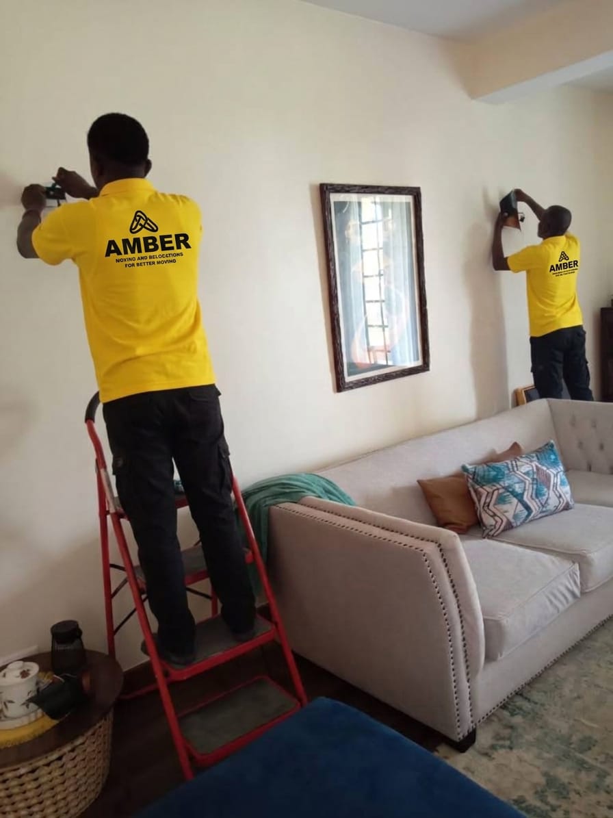 Amber team carefully fitting curtains in a customer's home